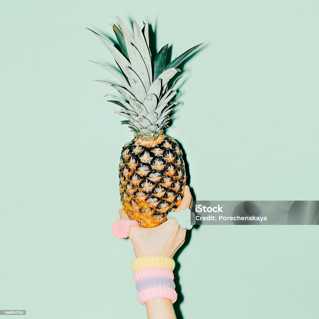 Fashion photo. Hand holding pineapple. vanilla style 2015 Stock Photo