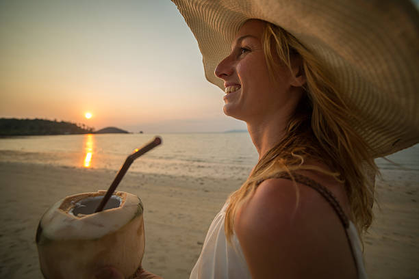 istock Happy tourist on tropical beach looking a sunset 468842556