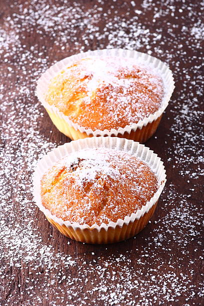 istock Delicious muffins on a wooden table 468842790