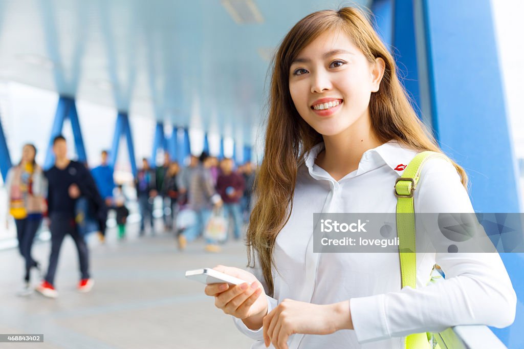 asian beautiful woman using smart phone  portrait on footbridge asian beautiful woman using smart phone  portrait on footbridge,modern telecommunication and lifestyle concept 2015 Stock Photo