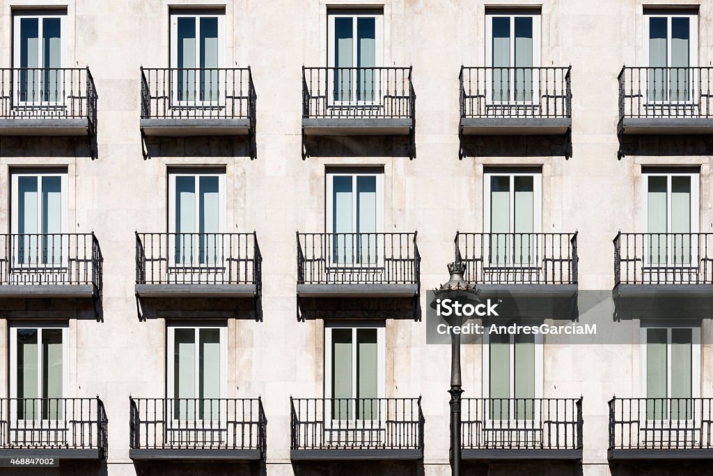 Windows and balconies in a traditional house in Valladolid, Spain Traditional windows and balconies on the main facade of a traditional house in Valladolid, Spain. 2015 Stock Photo