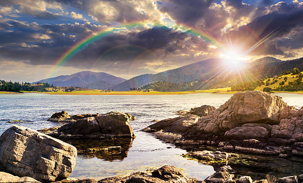 istock lake with boulders in mountains at sunset 468847850