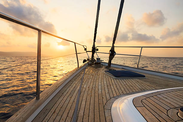 istock Yacht sailing at sunset 468850351