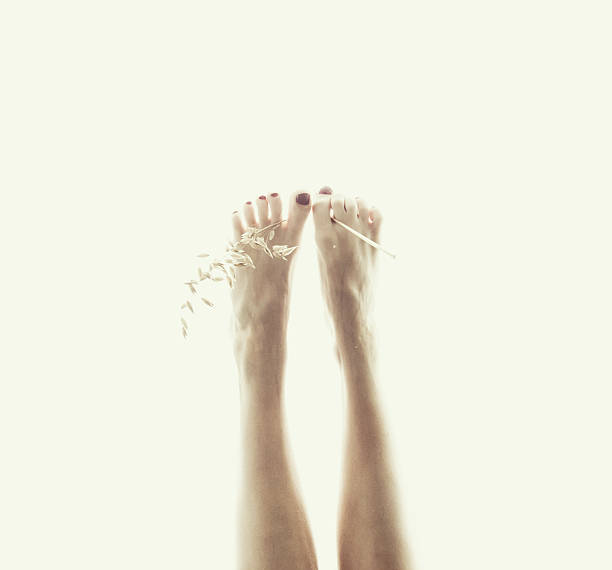 foot with a dry twig