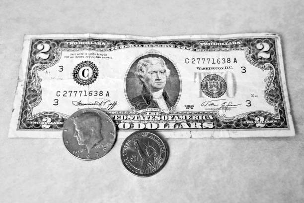 istock two dollars, 1$ coin and 50cent 468850434