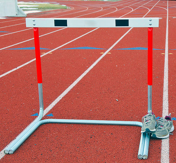 istock Trackshoes and hurdle 468851662