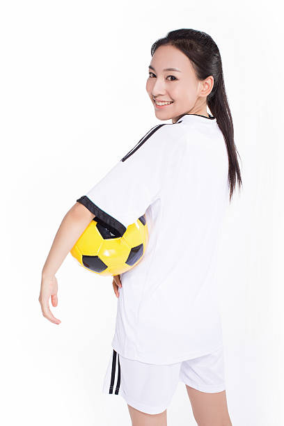 istock woman with soccer ball 468852168