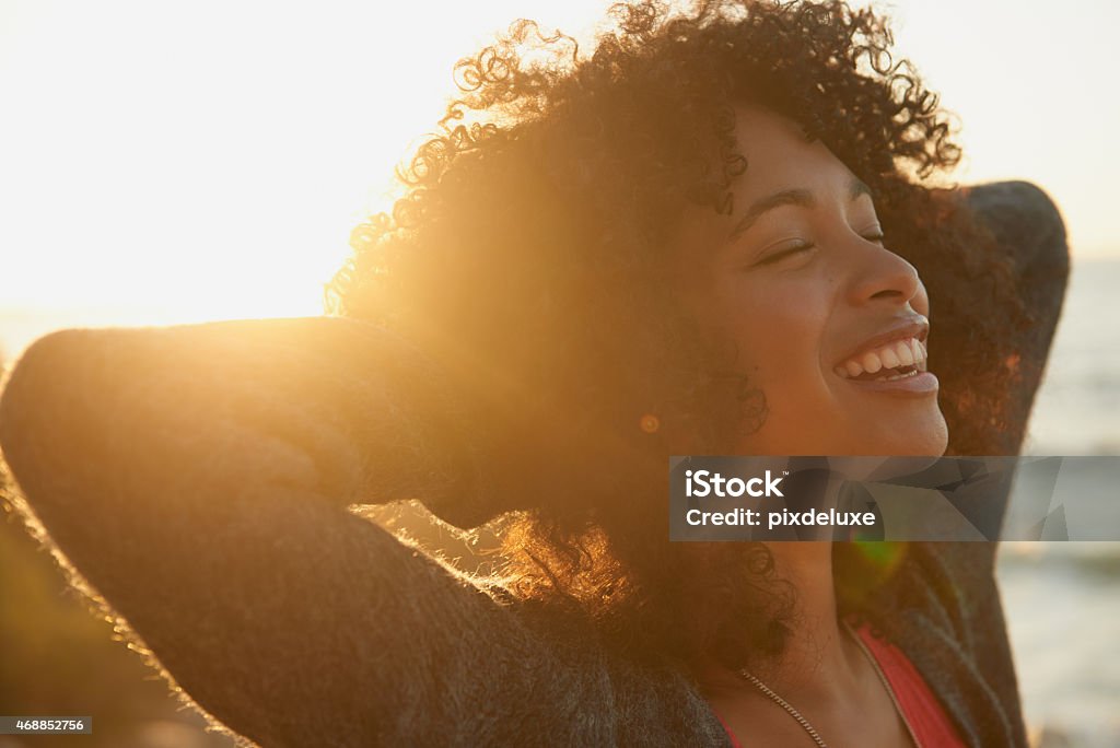 Moments like these make me feel alive Closeup shot of an attractive young woman enjoying nature One Woman Only Stock Photo