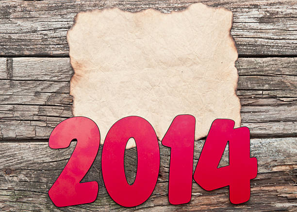 istock 2014 New Year holiday background with old crumpled paper sheet 468854729