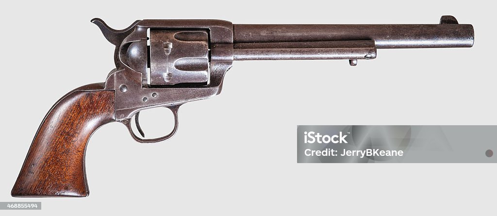 Colt '45 Single-Action Army Pistol, commonly known as the Colt .45 or the Peacemaker, on a white background and viewed from the right side.  The pistol was manufactured in the early 1880s and is in excellent condition. Handgun Stock Photo