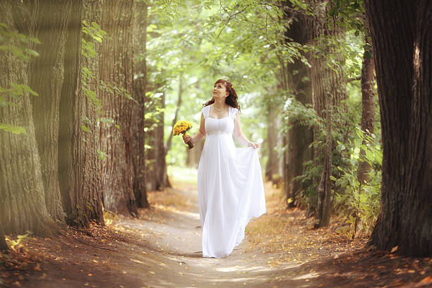 bride wedding a walk in the park in the woods