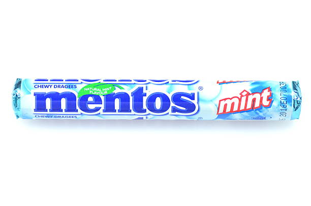 Mentos chewy dragees Kwidzyn, Poland - March 4 , 2014: Mentos chewy dragees sold in over 130 countries by the Perfetti Van Melle corporation. Mentos was first produced in the Netherlands in 1948 Mentos stock pictures, royalty-free photos & images