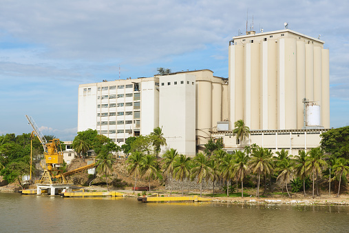 Santo Domingo, Dominican Republic - November 07, 2012: View from the Ozama Fortress to the industrial building on the opposite side of the Ozama river in downtown Santo Domingo, Dominican Republic.