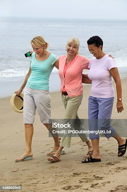 Women Walking Beach Together Stock Photo - Download Image Now - Mature Women, Multiracial Group, 30-39 Years