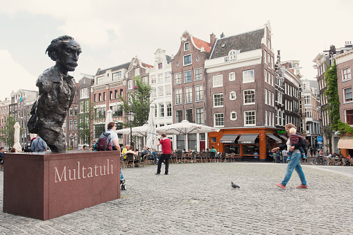 Amsterdam, Netherland - August 18, 2013: Statue of Multatuli on a square over the Singel canal in Amsterdam.