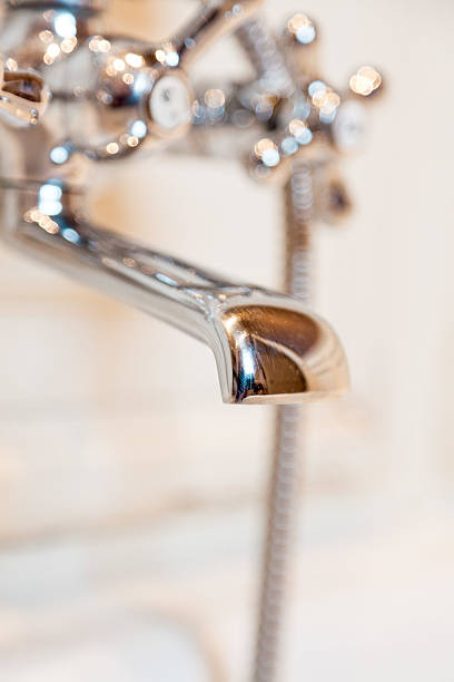 istock Closeup of classic bath tap in white bathroom. 468861537