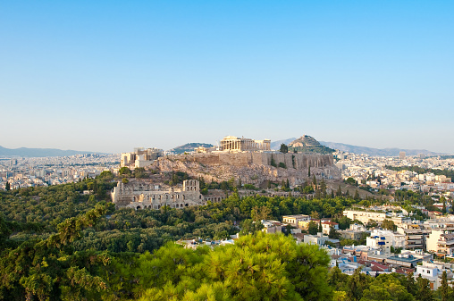 View of modern city of Athens and Arches of Odeon of Herodes Atticus. Greek stock photo.