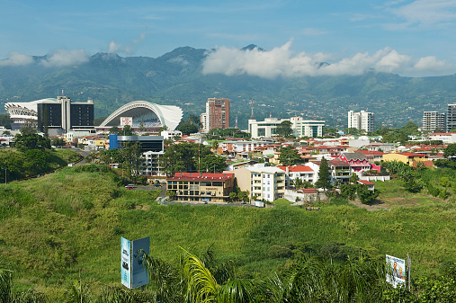 San Jose, Costa Rica - June 18, 2012: View to the National Stadium and buildings with mountains at the background in San Jose, Costa Rica.