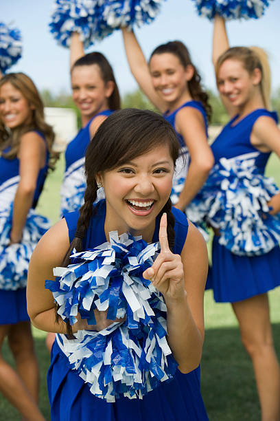 istock Cheerleader Showing Squad is Number One 468862991