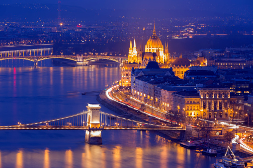 Budapest, Hungary - February 22, 2024: Night city landscape. Buda castle on the background.