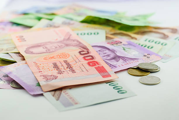 istock Thai money banknotes and coins 468864018