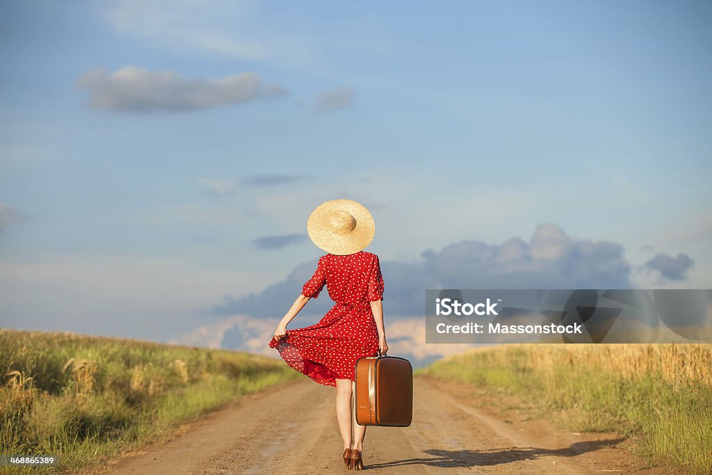 Redhead girl with suitcase at outdoor. Women Stock Photo