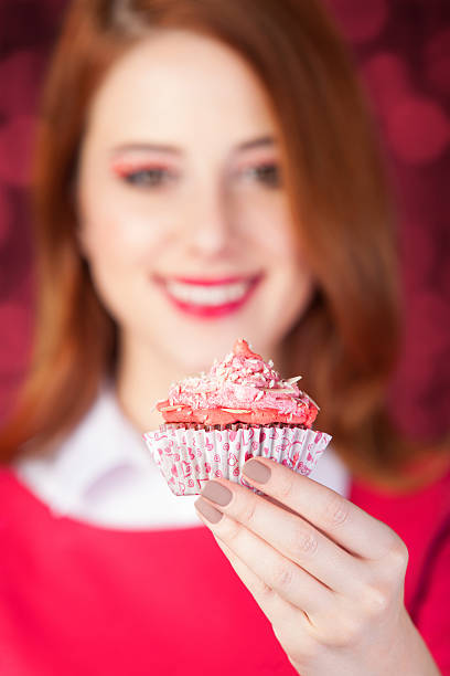istock Redhead girl with cake. 468867163