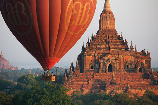 Bagan, Myanmar - January 7, 2015: Hot air balloons fly over Bagan, that always recognised as amazing buddhism landmark.