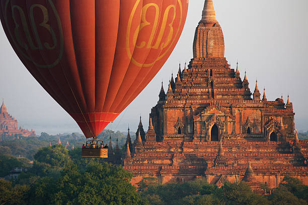 Hot air balloon Bagan, Myanmar - January 7, 2015: Hot air balloons fly over Bagan, that always recognised as amazing buddhism landmark. mandalay photos stock pictures, royalty-free photos & images