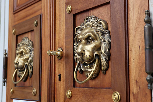 Antique Bronze Door Handle on Old Wooden Door