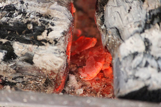 istock Image of fireplace / open fire with embers, ash burning logs 468867716