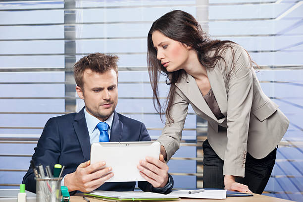 istock Two business colleagues working together in an office 468867765