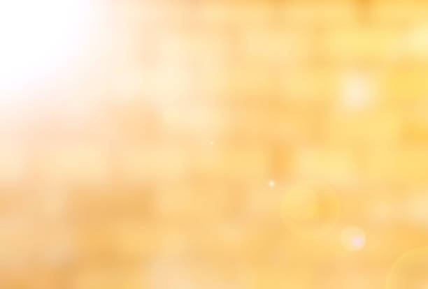 istock Blurred brick wall in orange yellow tone abstract with flare 468870972
