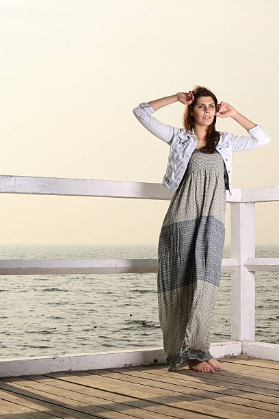 istock young woman on the pier 468874183