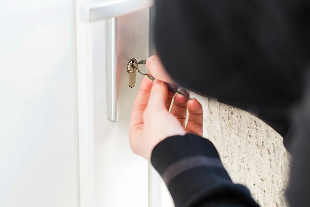 istock Burglar using special tools to break in  a house 468874304
