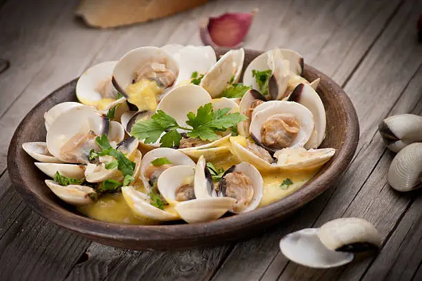 Fresh Cockle clams (Venus, Meretrix) with wine sauce. Portuguese dish.