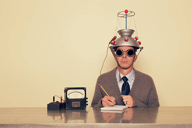Electrotherapy A student of the mind is ready to test his brain beyond its limits.  bizarre stock pictures, royalty-free photos & images
