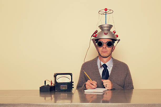 Electrotherapy A student of the mind is ready to test his brain beyond its limits.  Bizarre stock pictures, royalty-free photos & images