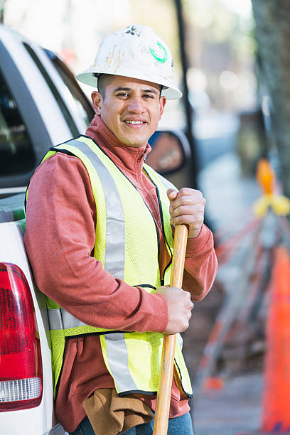 istock Hispanic construction worker with pickup and shovel 468877610