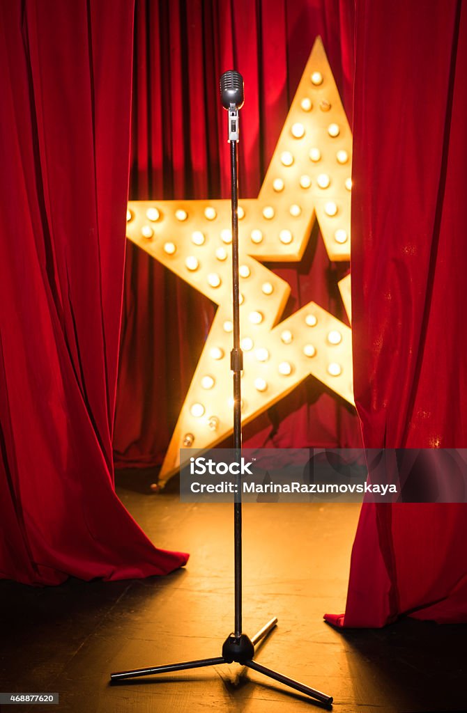Standing on stage concert, vintage microphone Curtain Stock Photo