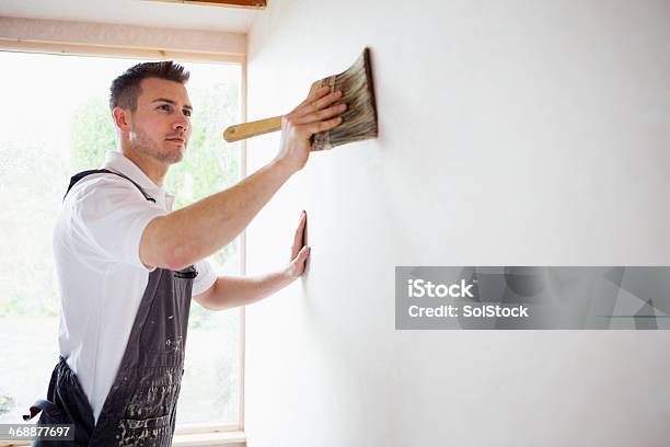 Concentrating While Decorating Stock Photo - Download Image Now - Painting - Activity, House Painter, Wall - Building Feature