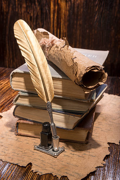 istock Vintage golden pen and ancient manuscripts 468879786