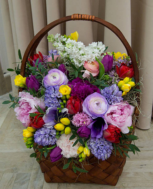 istock Big basket full of many multicolored flowers 468880000