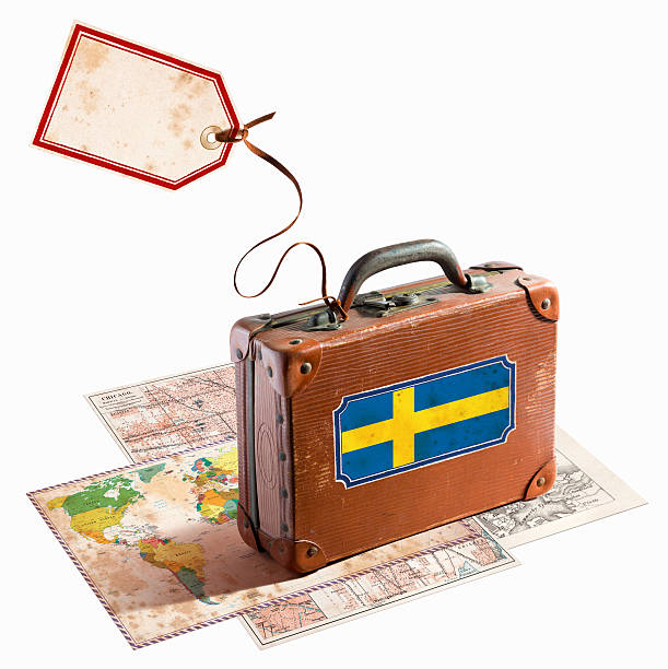 istock Antique leather suitcase on different maps Sweden flag 468881401