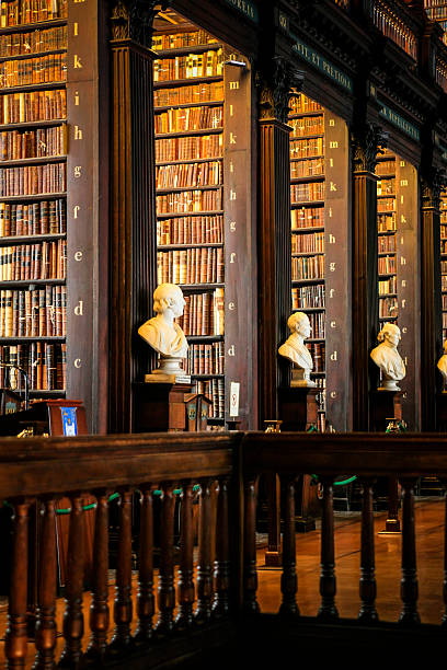 Trinity College Library Dublin Dublin, Eire - November 17, 2013: Thousands of books on shelves inside the Trinity College Library Dublin, Part of the University of Dublin trinity college library stock pictures, royalty-free photos & images