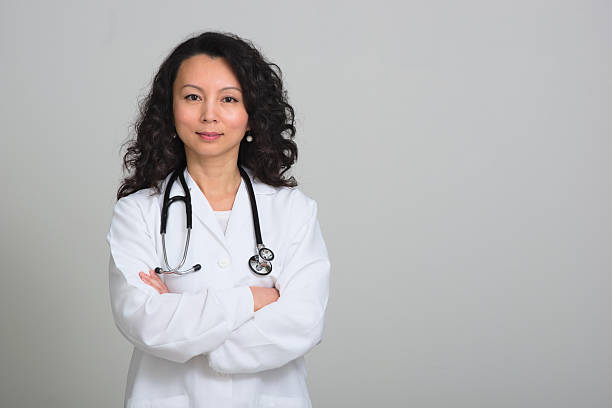 istock Asian female doctor with stethoscope 468884988