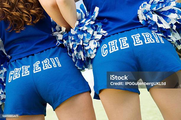 Cheerleaders Wearing Cheer Hotpants Stock Photo - Download Image Now - Teenage Girls, Cheerleader, Hot Pants