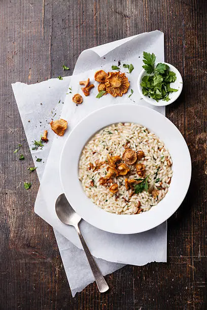 Risotto with chanterelles in white bowl