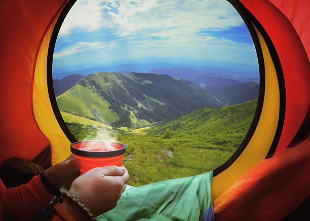 istock Woman lying in a tent with coffee 468888608