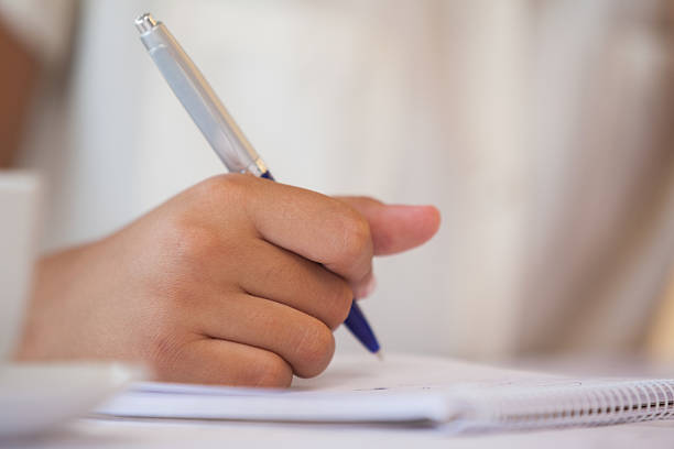 istock Mid section of a businesswoman writing in notepad 468891396